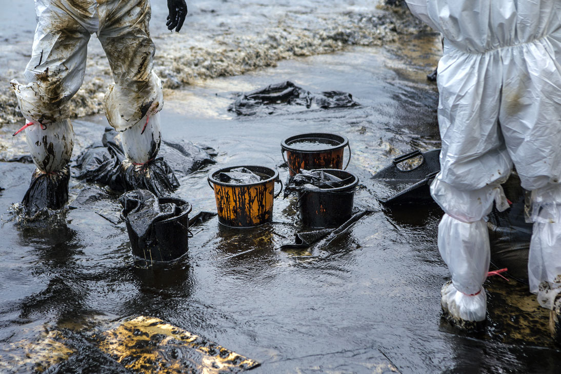 Workers Removing Crude Oil